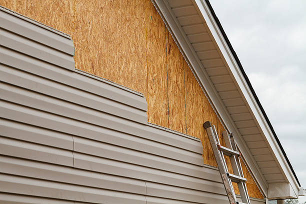 Professional Storm Damage Siding Repair technician working in Trappe, PA